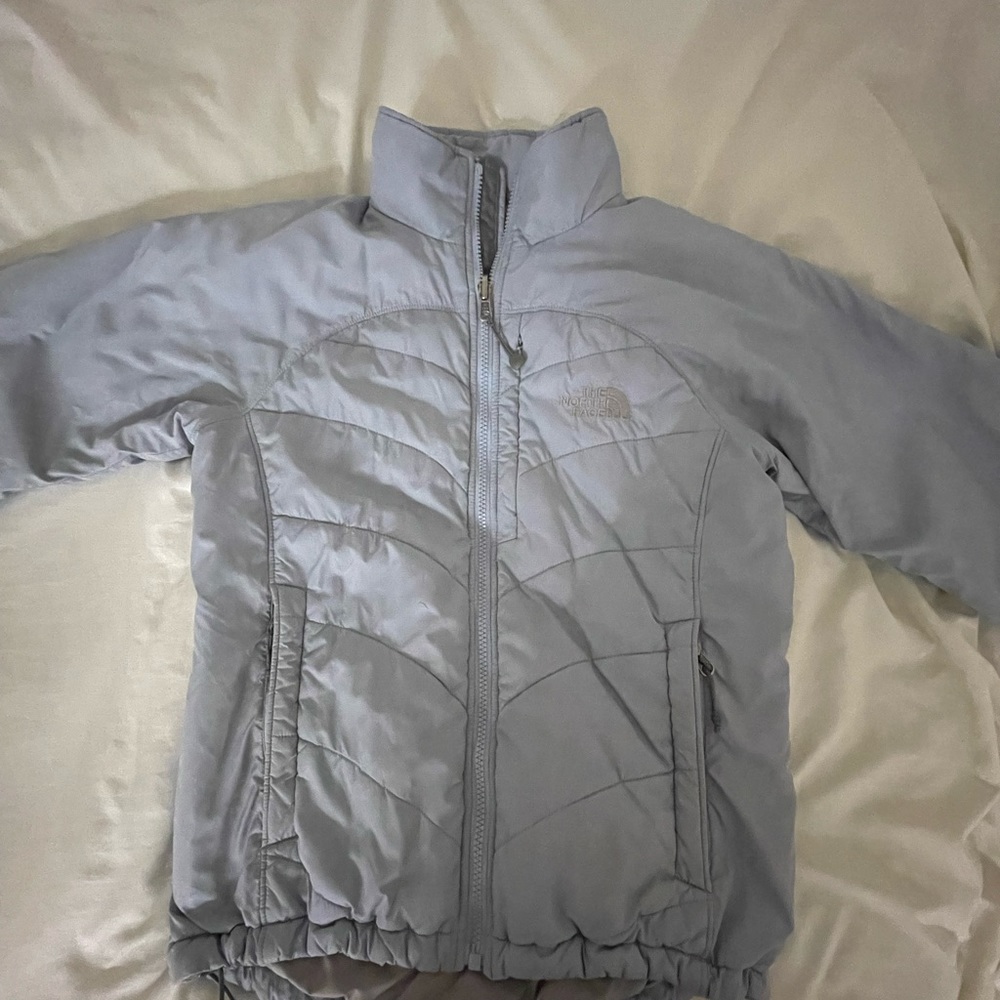 Blue North Face puffer jacket